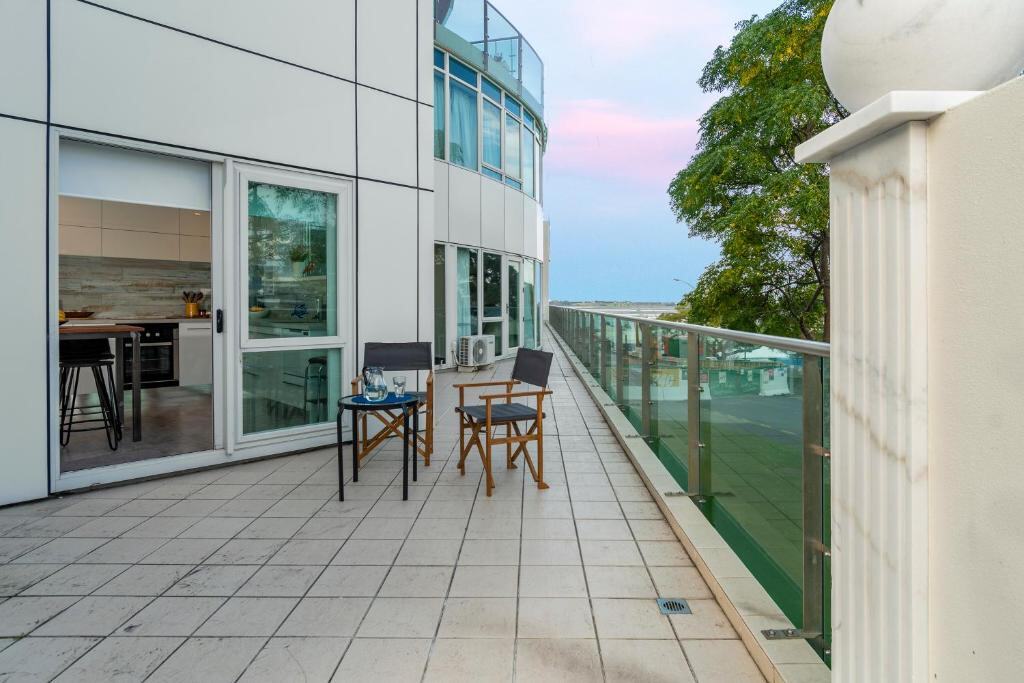 Private balcony with outdoor seating and city view